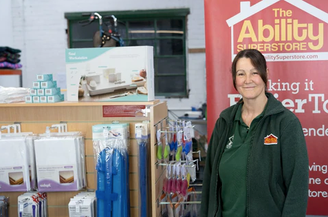 Picture shows Carol (one of the Ability Superstore employees) standing in the Ability Superstore shop