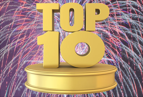 Bright and colourful fireworks can be seen in the background. The – Top 10 – logo is on top of the fireworks