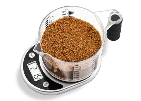 This is a photograph of the Talking Kitchen Measuring Scale and Jug set, which can be found on Ability Superstore.
