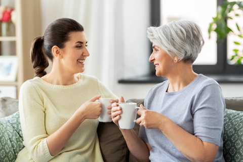 2 women with cups of tea