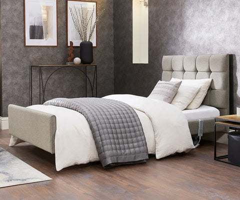 This is the Opera Signature Comfort set up. There's a range of pillows and blankets, as well as a grey bed spread.