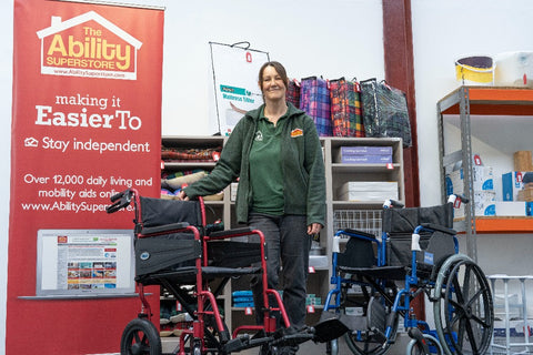 Carol from Ability Superstore in the mobility aid retail shop with wheelchairs and rollators