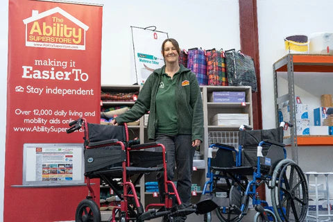 A picture showing Carol (one of the team at Ability Superstore) standing in the middle of the Ability Superstore shop