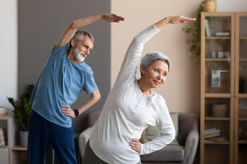 An image of a senior couple stretching at home