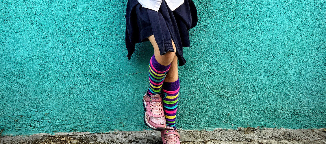 Girl wearing a skirt and socks - How to Style Crew Socks