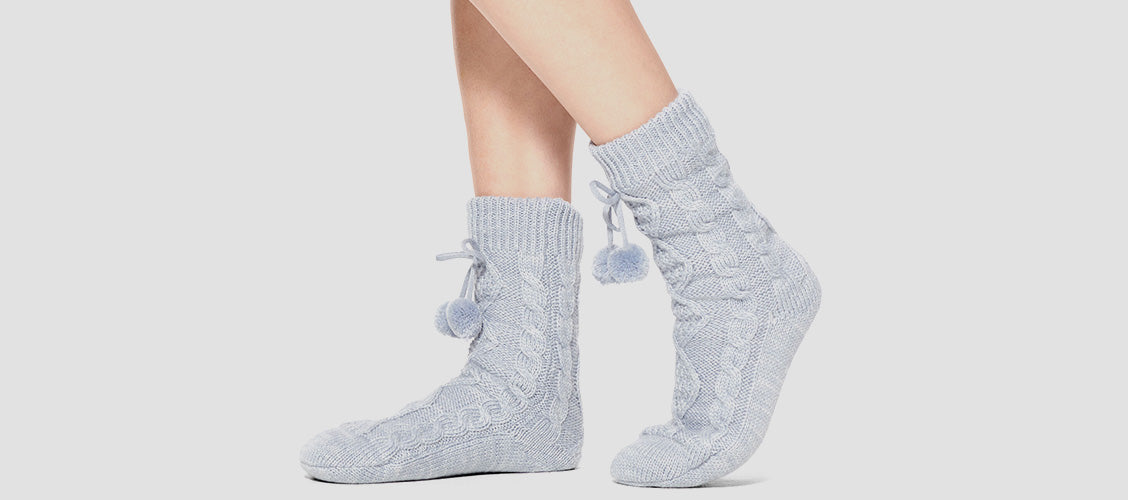 Woman wearing knit gray slipper socks - 10 Unexpected Socks