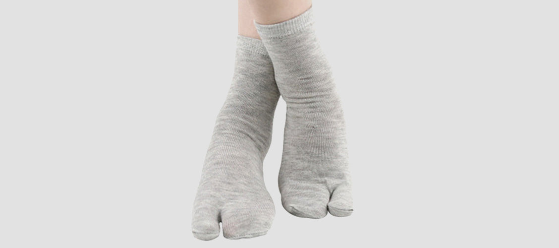 Woman wearing gray split-toe socks - 10 Unexpected Socks