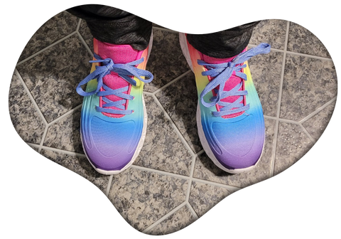 Rainbow coloured shoes with pink tongues and periwinkle laces, in a heart shaped frame