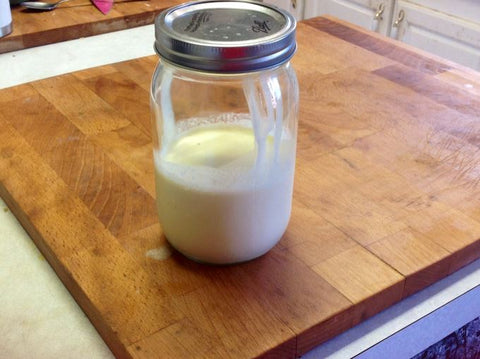 Quart mason jar halfway filled up with heavy cream