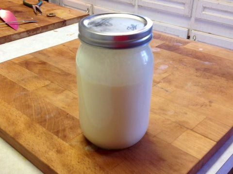 Quart mason jar three quarters full of heavy cream
