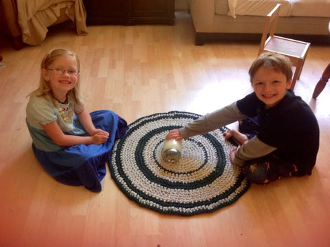 Children playing with a jar