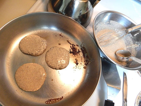 Making sourdough pancakes in a pan 