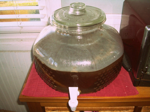 Kombucha in a big faucet glass jar