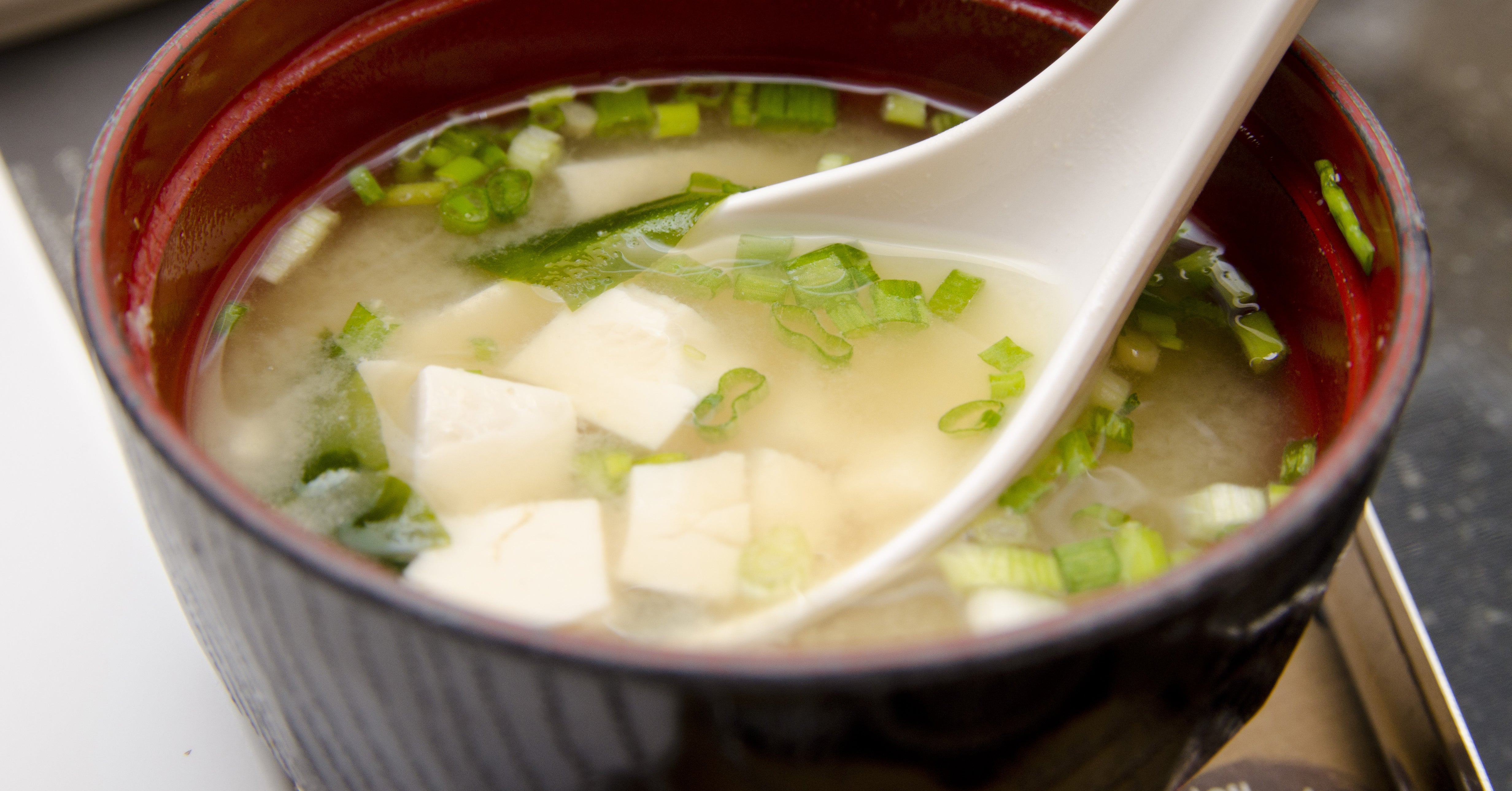 miso soup with tofu and soup spoon