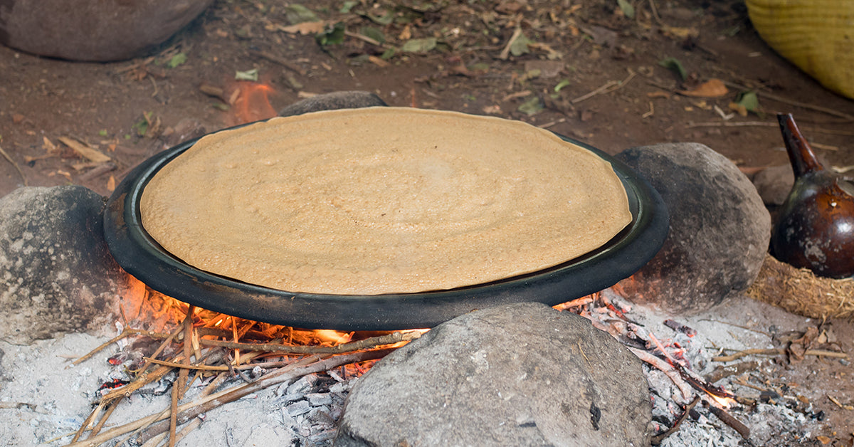 Ethiopia injera being prepared on an open flame