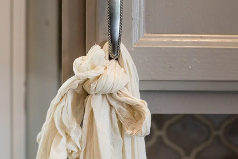 Hanging Butter Muslin filled with the Cultured Milk