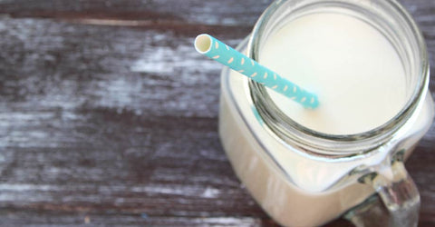 Milk in a Mason Jar with Blue disposable Straw