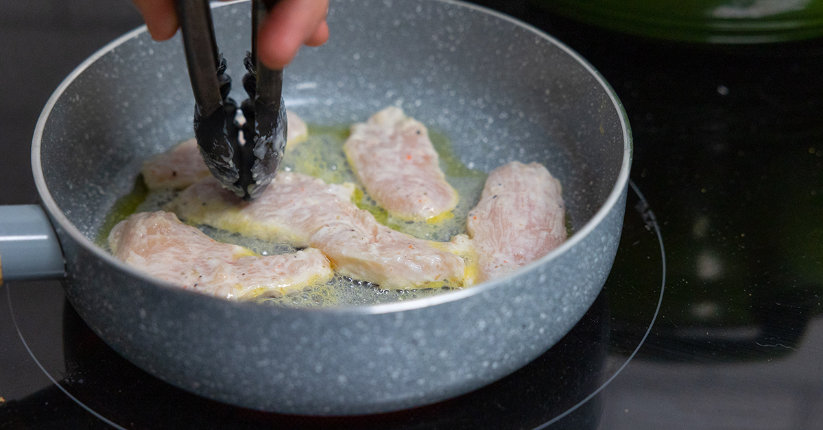 cooking chicken with the spicy yogurt marinade