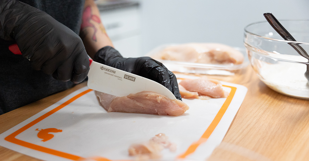 cutting chicken for the spicy yogurt marinade