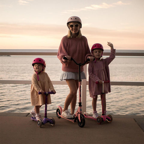 Micro Ambassador Ula scooting with her kids at sunset