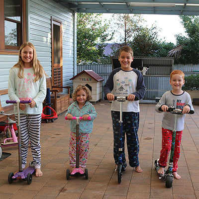 Micro Family on their scooters