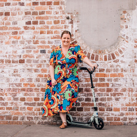 Stylish mum with her 2 wheel push scooter