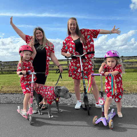 The Blair Family pose in matching Christmas outfits with their Micro Scooters