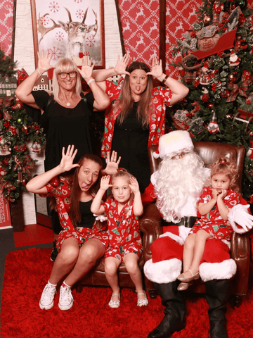 The Blair Family pose with Santa Claus