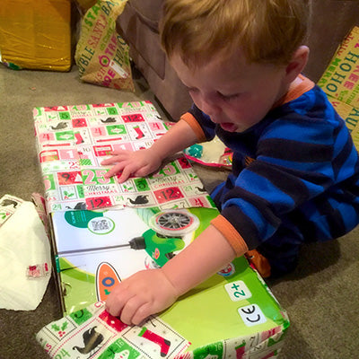 Boy opening his Micro Scooter Christmas Present 