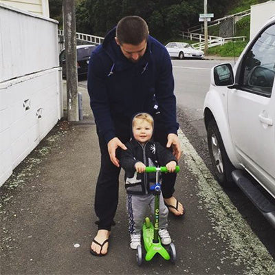 All Black Captain Scooting with his kids 