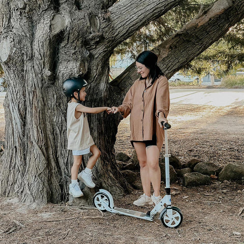 micro ambassador aneta with her son riding a micro classic adult scooter