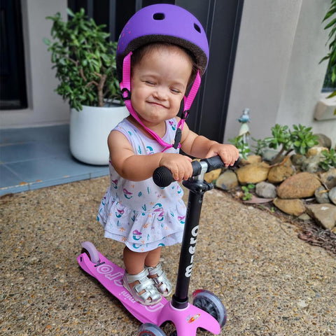 micro ambassador edith and her child on a mini2go 3 wheel pink scooter