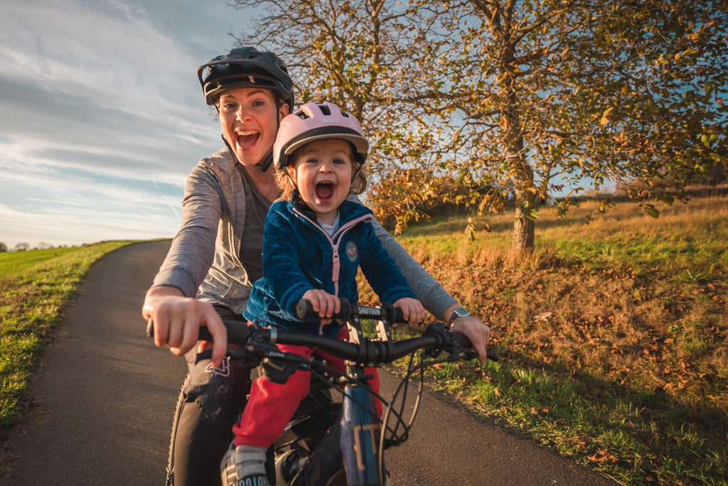 Mum and daughter riding a bike together-2