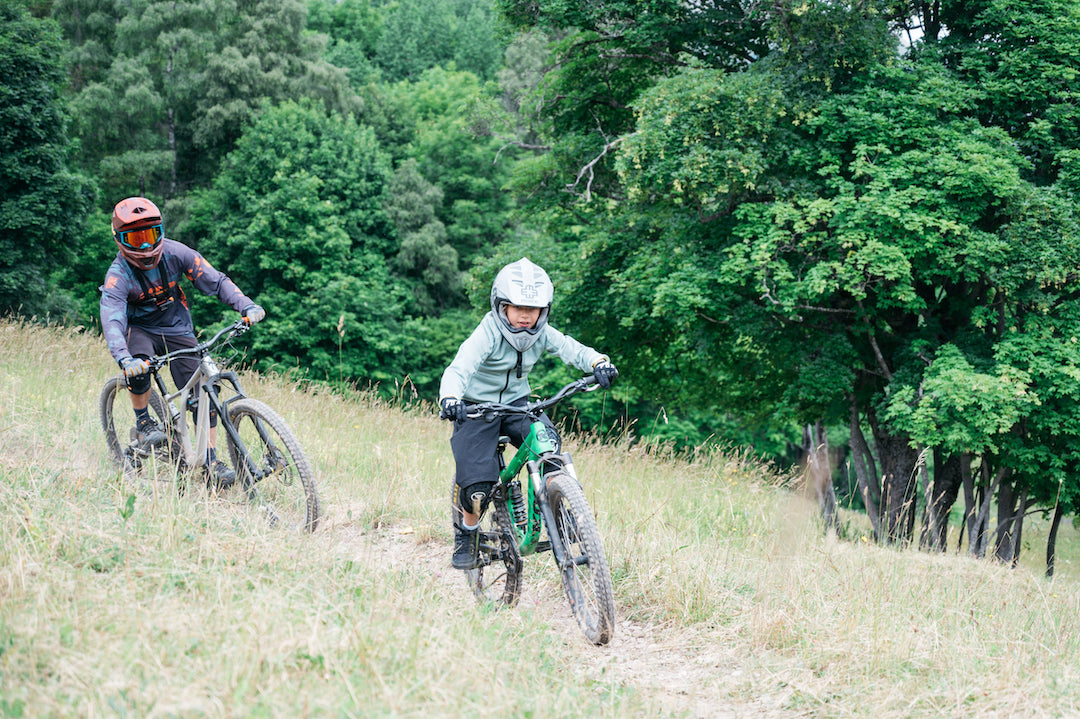 dad and son riding downhill
