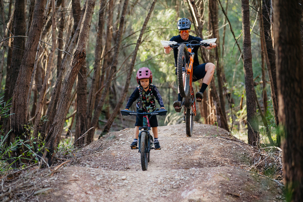 pro rider josh carlson and son eli mountain biking in australia