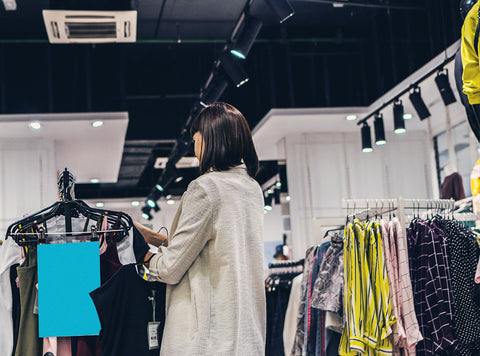 woman-shopping-inside-fast-fashion-store