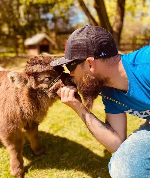 pasture puppy getting smooch