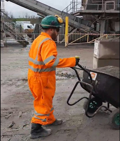 Workman at a cement factory using iTip EZ Tippa Handles 