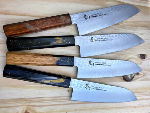 Four different double bevel knives on a table