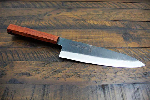 Japanese Gyuto knife on wood table