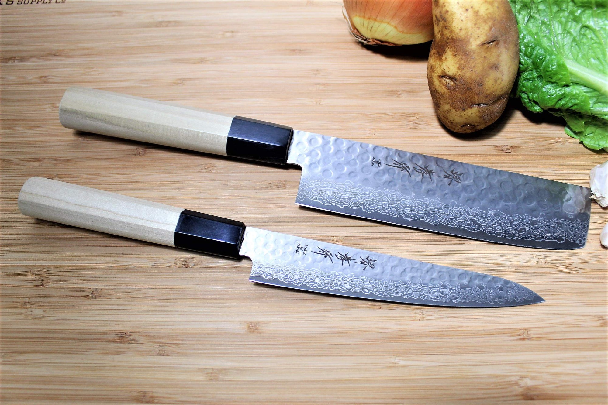 https://cdn.shopify.com/s/files/1/0077/4399/5970/files/kitchen-knives-sakai-takayuki-japanese-knife-set-damascus-45-layer-petty-knife-150mm-5-9-nakiri-vegetable-knife-160mm-6-3-1_9b12a60f-2c7d-4140-aef0-8a99811569f8_2000x.jpg?v=1698702871