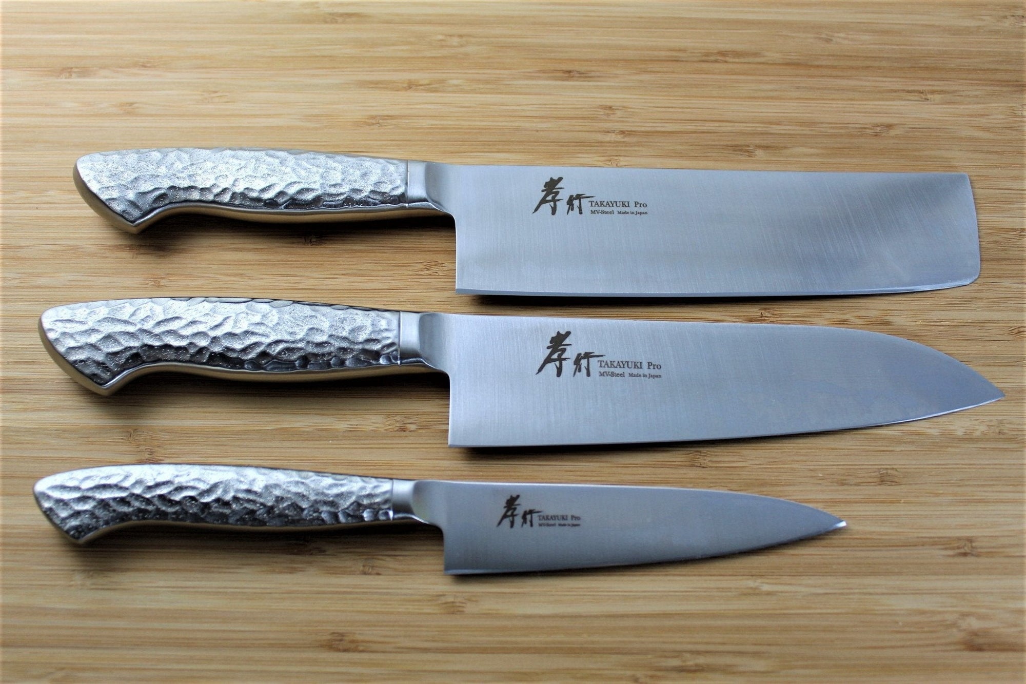 https://cdn.shopify.com/s/files/1/0077/4399/5970/files/kitchen-knives-sakai-takayuki-japanese-knife-set-inox-pro-molybdenum-stainless-steel-petty-knife-120-mm-4-7-santoku-knife-180-mm-7-1-nakiri-knife-180-mm-7-1-2_7fe26ff4-9f07-4a3b-be39-0e1d170996b4_2000x.jpg?v=1698701056