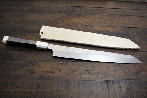 Yanagiba knife next to sheath