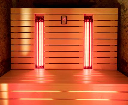 an infrared sauna with red LED lights