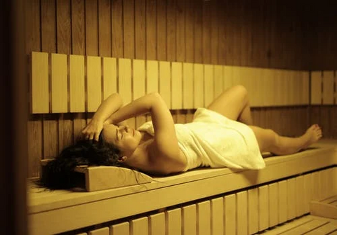 a woman inside a sauna