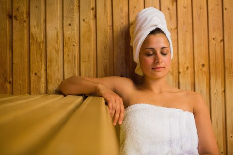 a woman taking a sauna bath