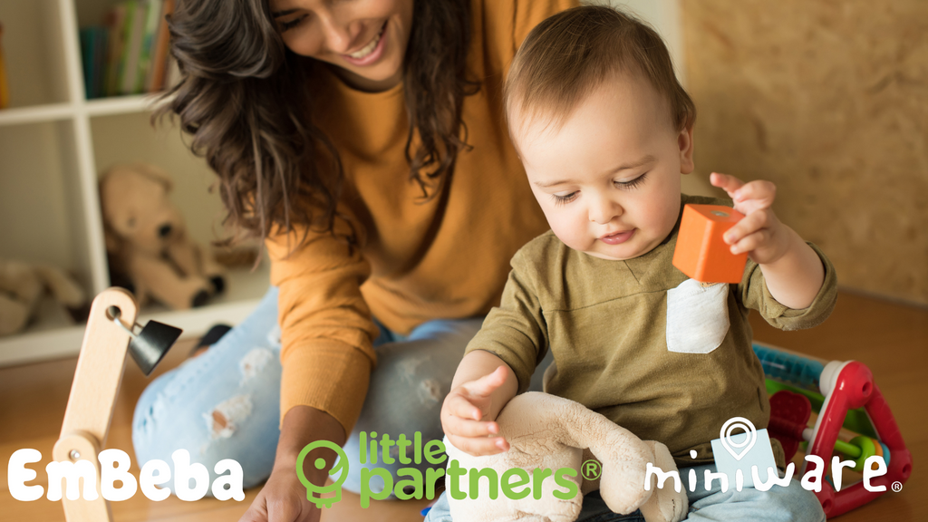 Smiling mother playing with toddler using educational toys from Little Partners and Miniware for EmBeba's Ready, Set, Explore campaign.