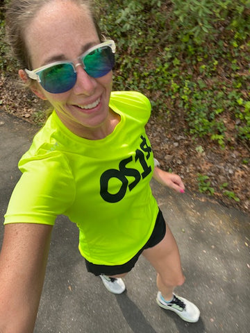 Amanda Ghent wearing yellow OS1st shirt running | OS1st
