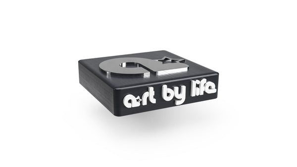 art by life brand lettering and icon on three-dimensional block with different material