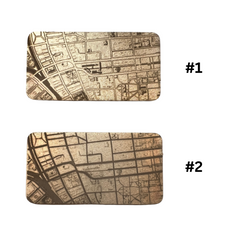 IMage of two different map styles test engraved on bronze